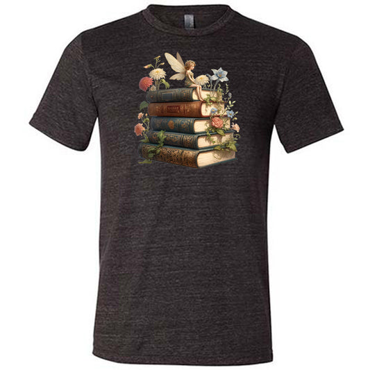 black shirt with a fairy sitting on books graphic in the center