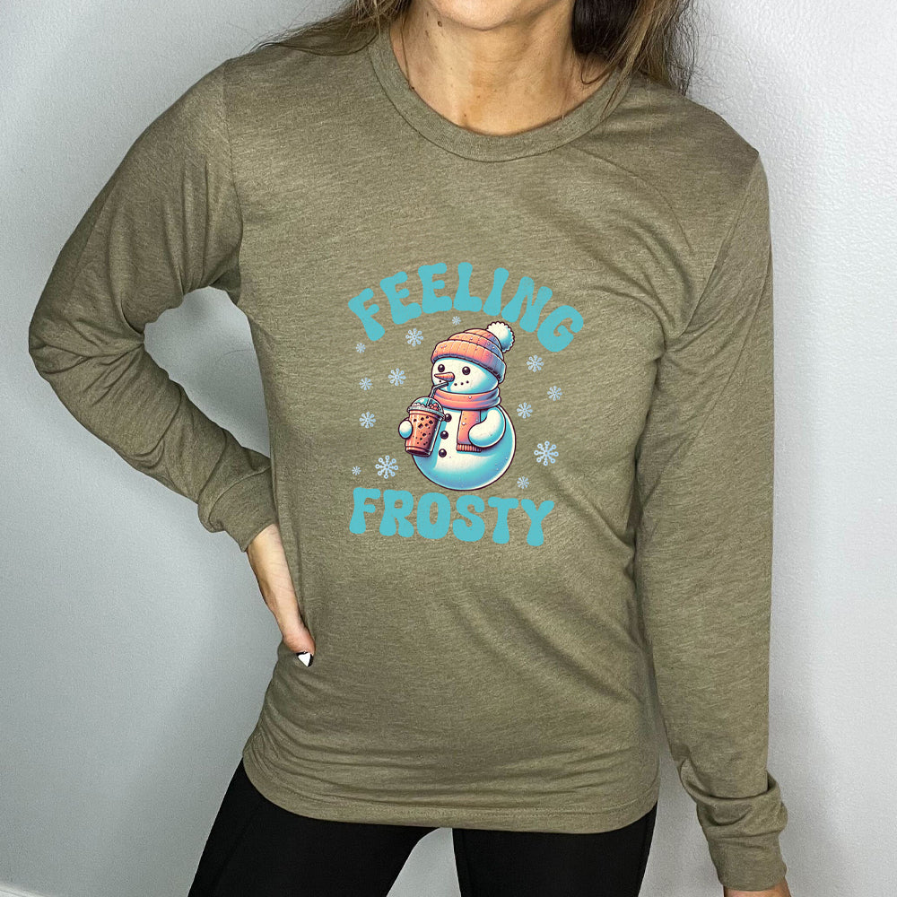 green long sleeve shirt with the text "Feelin Frosty" and a snowman graphic on it