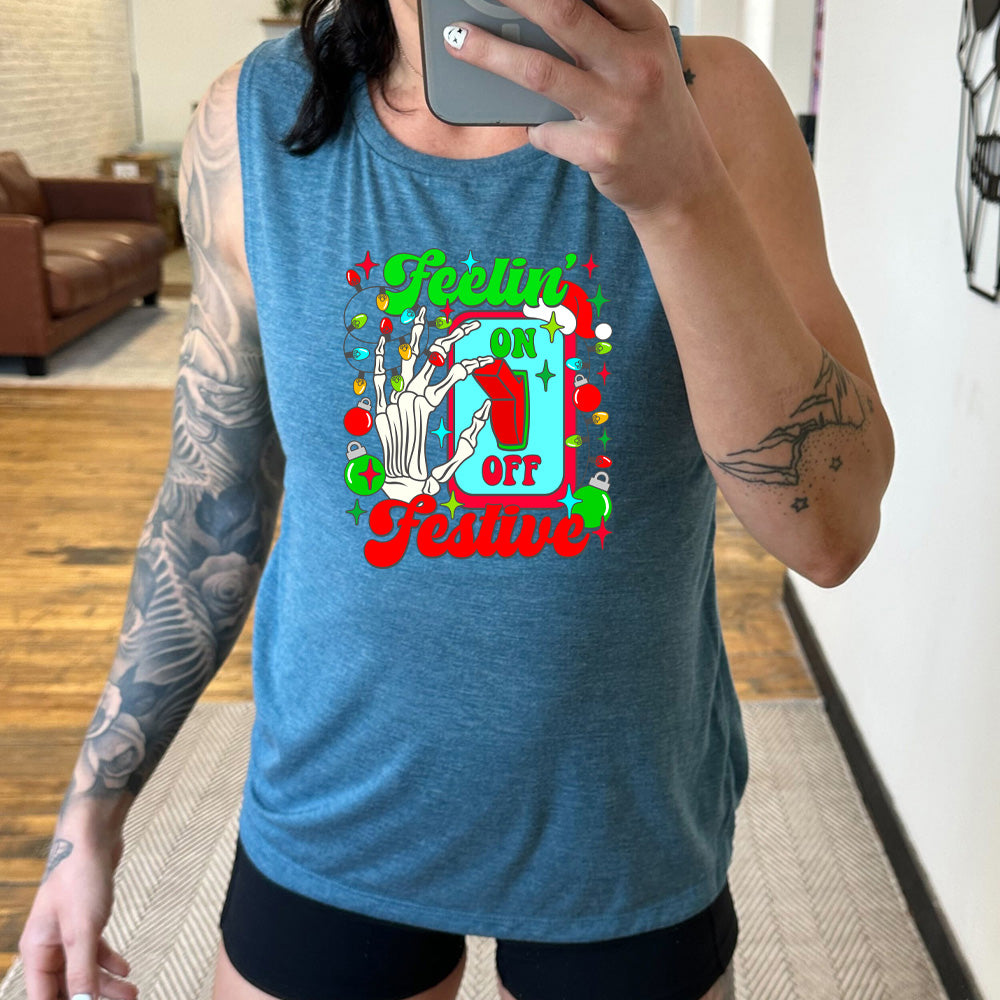 teal muscle tank with the text "Feelin' Festive" on it