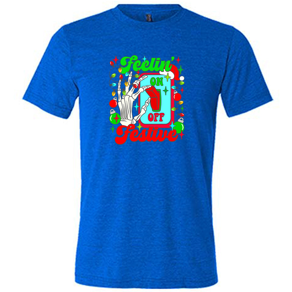 blue shirt with the text "Feelin' Festive" on it