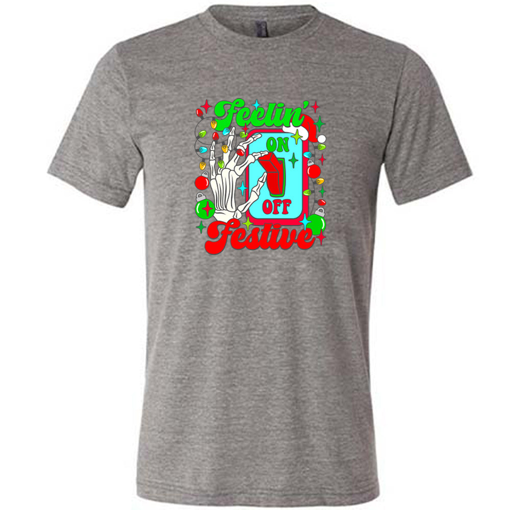 grey shirt with the text "Feelin' Festive" on it