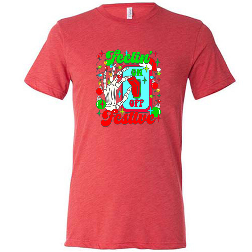 red shirt with the text "Feelin' Festive" on it