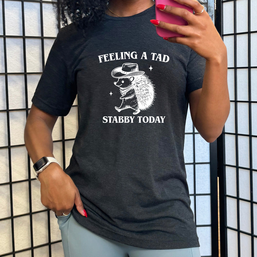 black shirt with the text "Feeling A Tad Stabby Today" on it