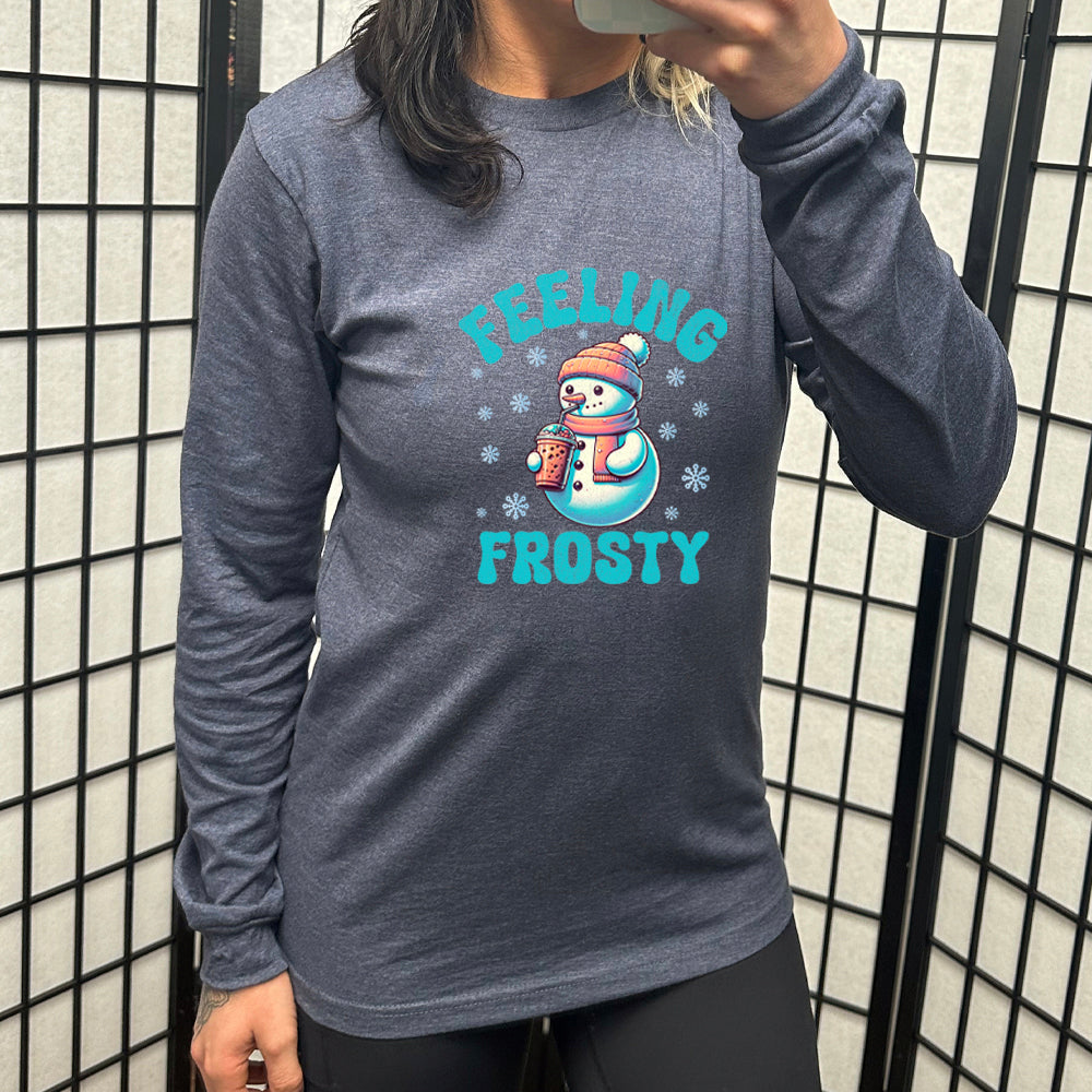 navy blue long sleeve shirt with the text "Feelin Frosty" and a snowman graphic on it