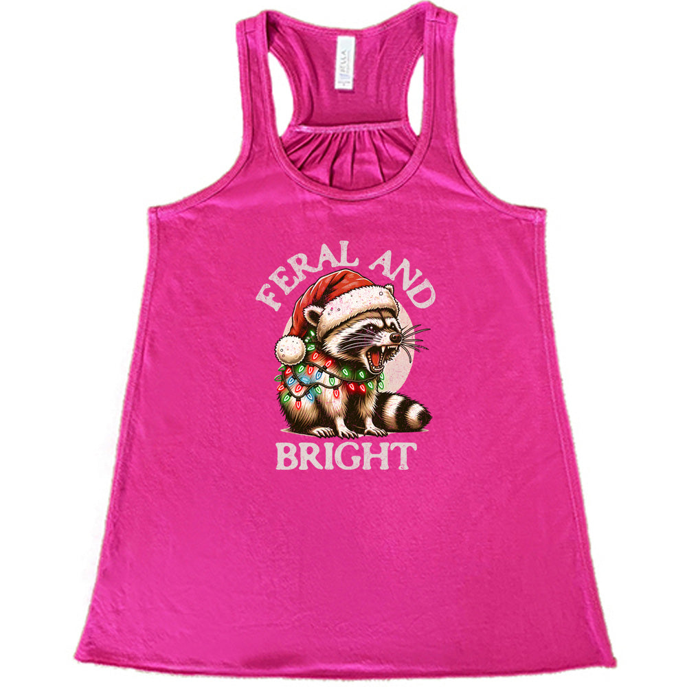 berry shirt with the text "Feral And Bright" with a raccoon graphic on it 