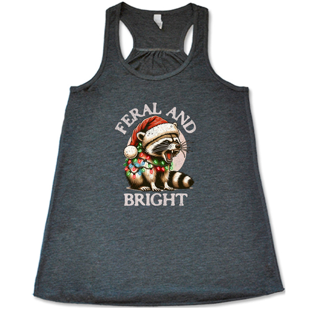 grey shirt with the text "Feral And Bright" with a raccoon graphic on it 