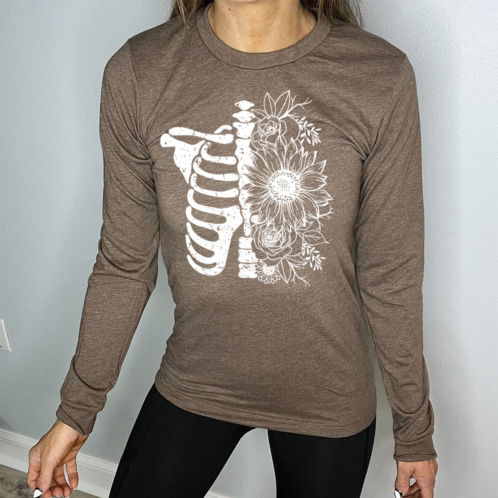 brown long sleeve shirt with a white Floral Ribcage graphic on it