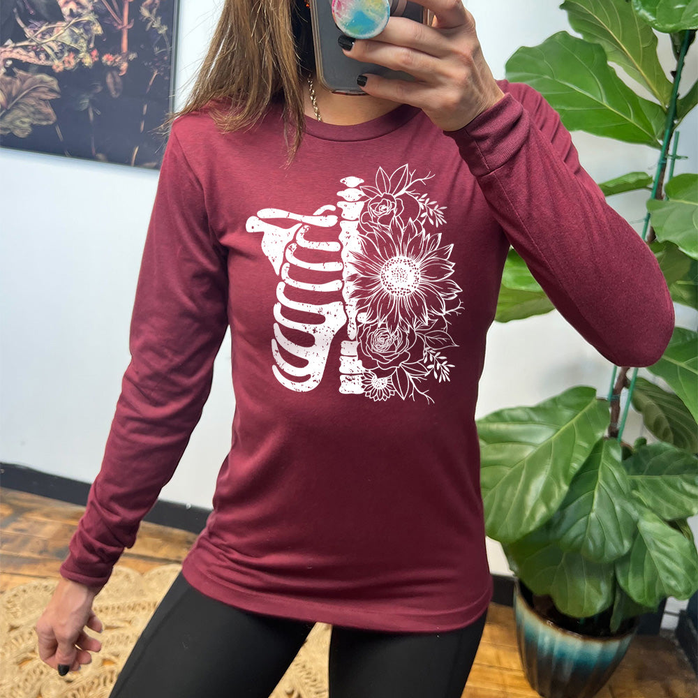 maroon long sleeve shirt with a white Floral Ribcage graphic on it