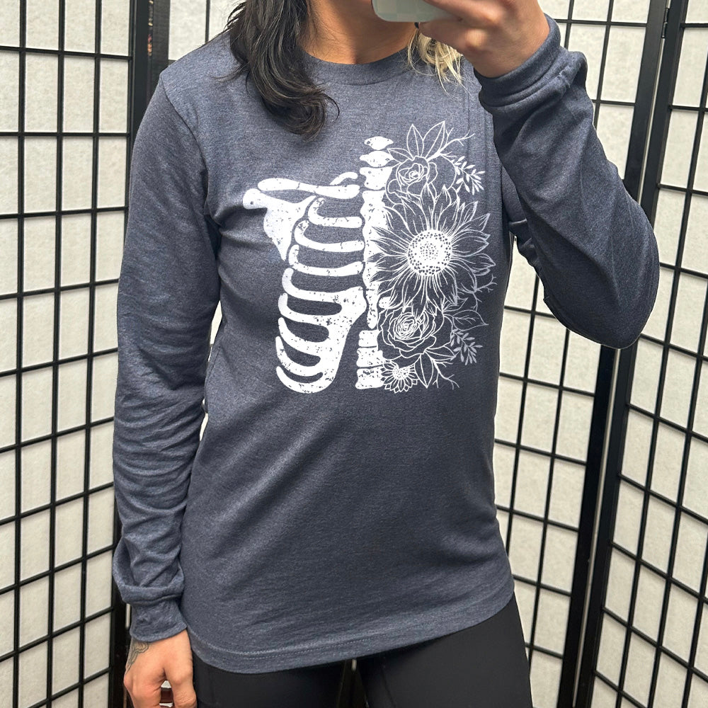 navy blue long sleeve shirt with a white Floral Ribcage graphic on it