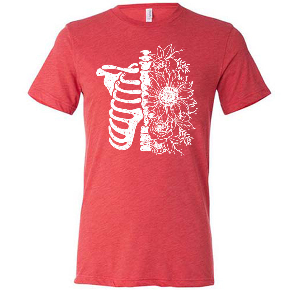 red shirt with a white Floral Ribcage graphic on it