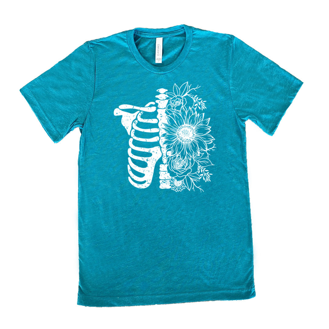 teal shirt with a white Floral Ribcage graphic on it