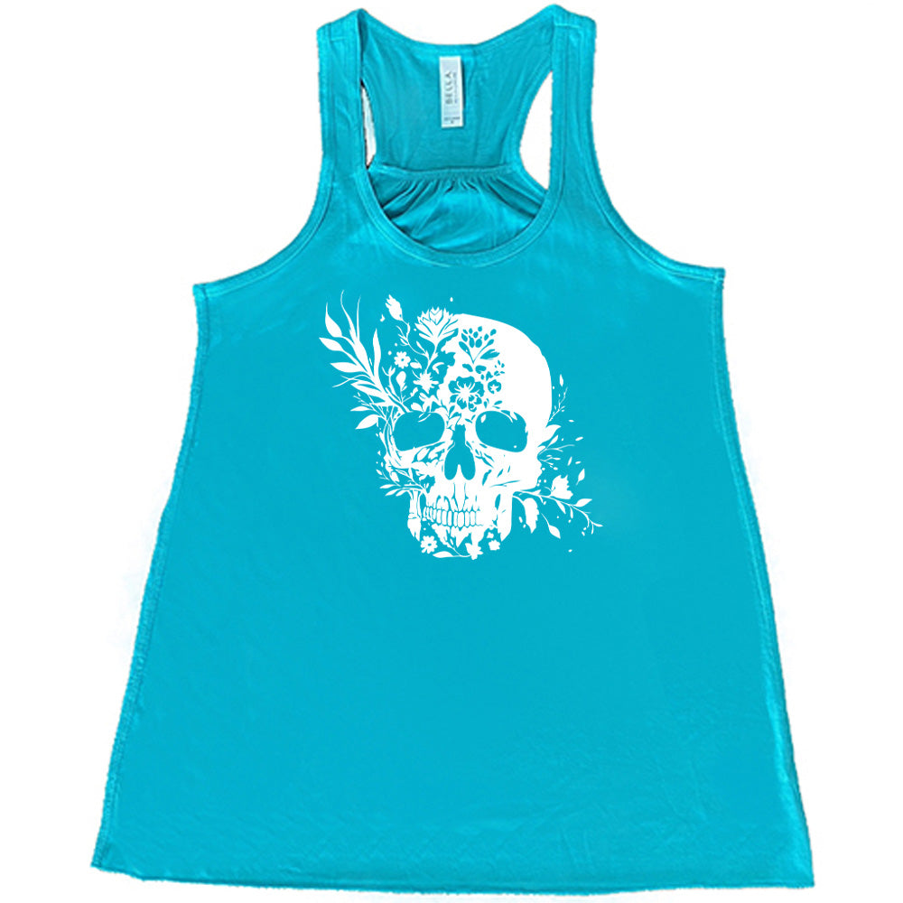 teal shirt with a white Floral Ribcage graphic on it