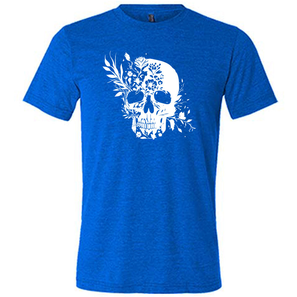 blue shirt with a white floral skull graphic on it