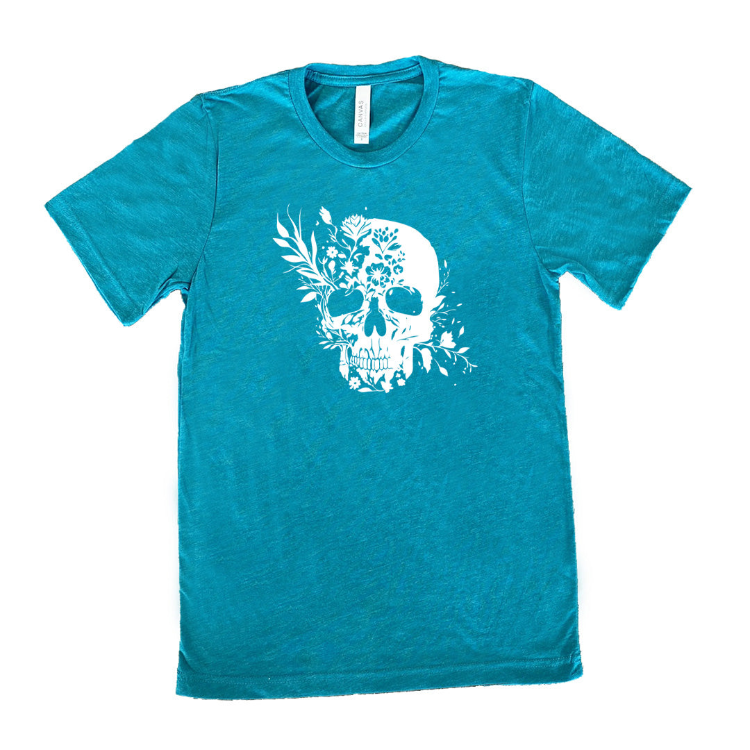 teal shirt with a white floral skull graphic on it