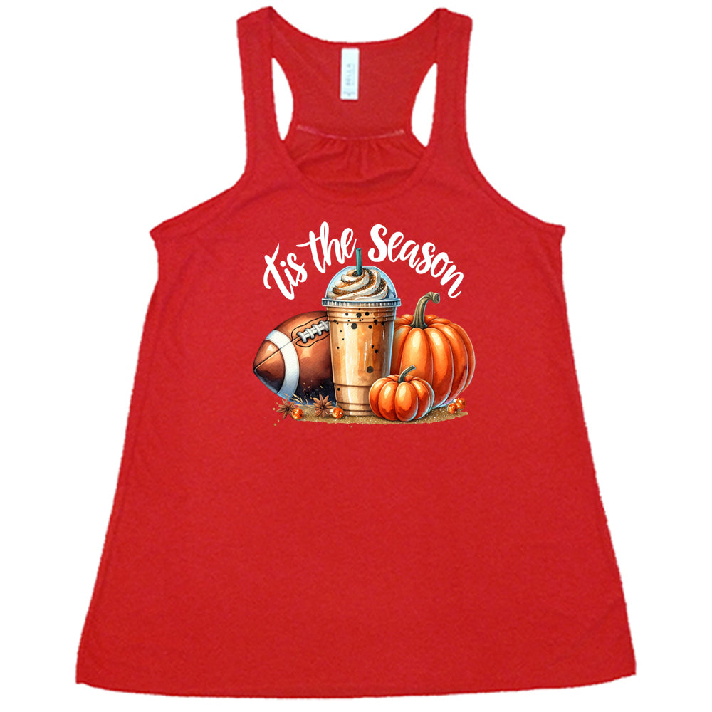 red shirt with a football, coffee and pumpkin graphic on it with the quote "tis the season" on it