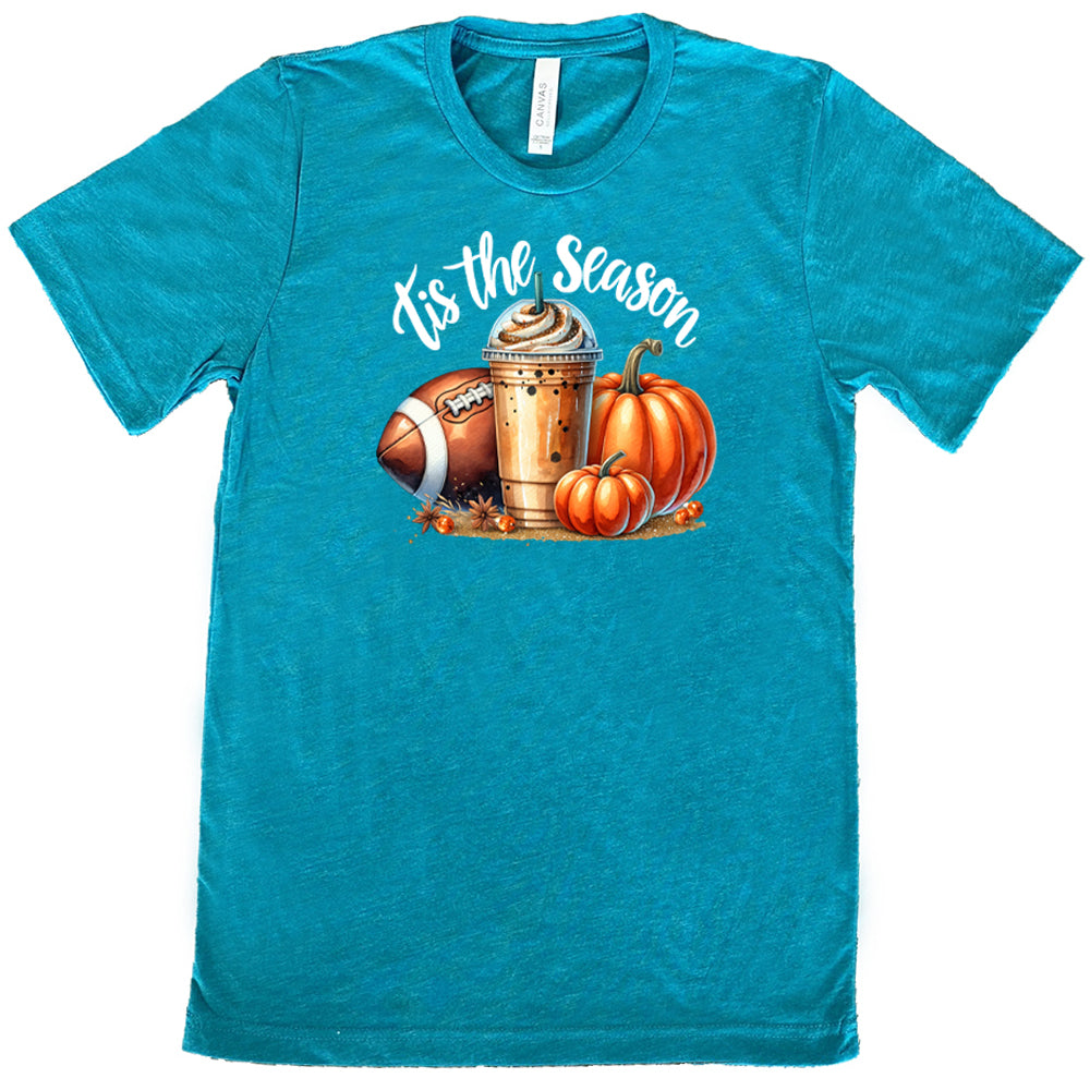 teal shirt with a football, coffee and pumpkin graphic on it with the quote "tis the season" on it