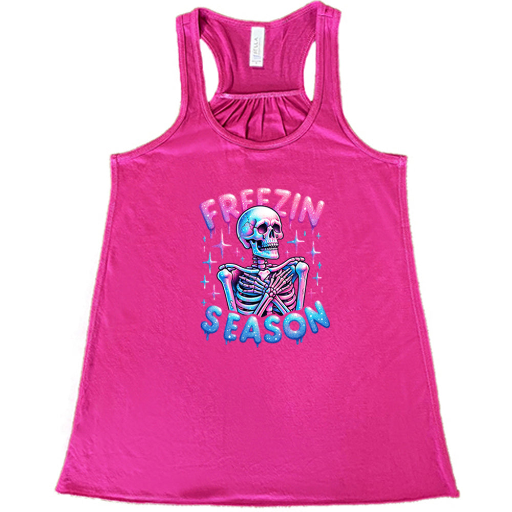 berry shirt with the text "freezin season" with a graphic of a skeleton on it