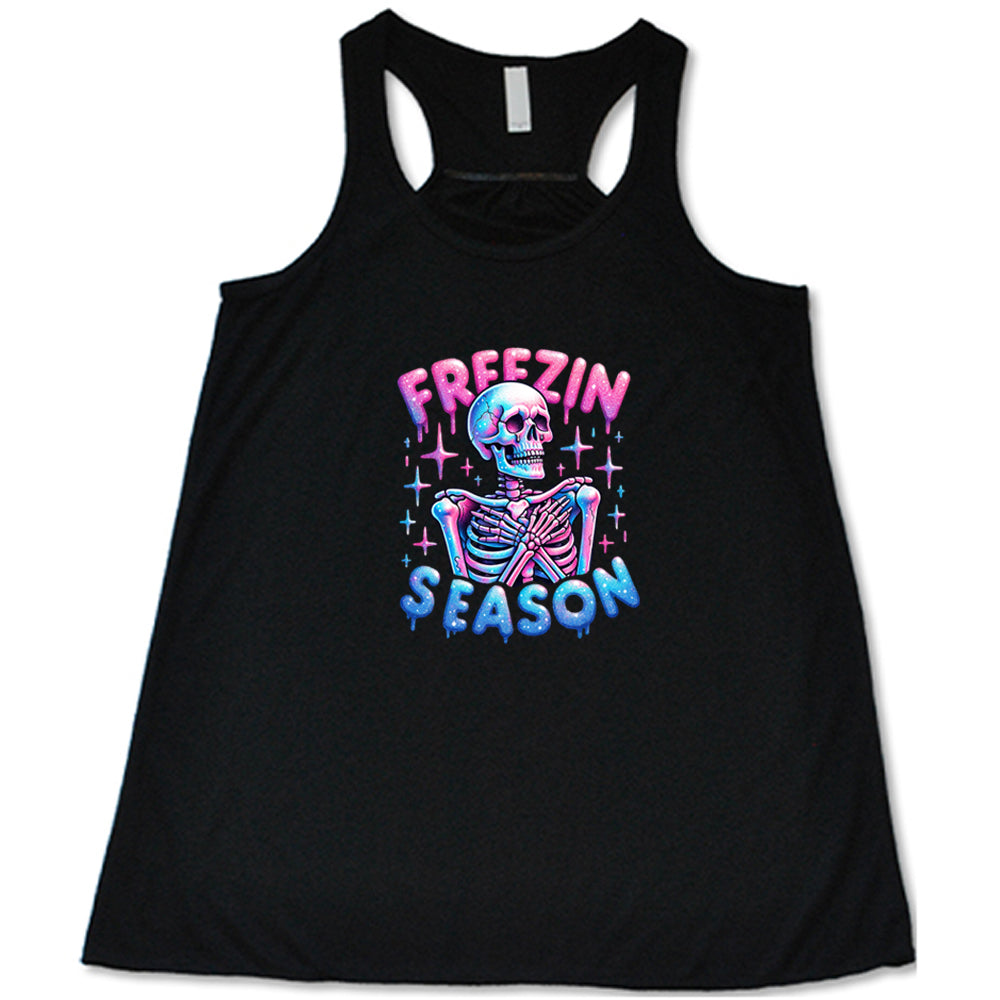 black shirt with the text "freezin season" with a graphic of a skeleton on it