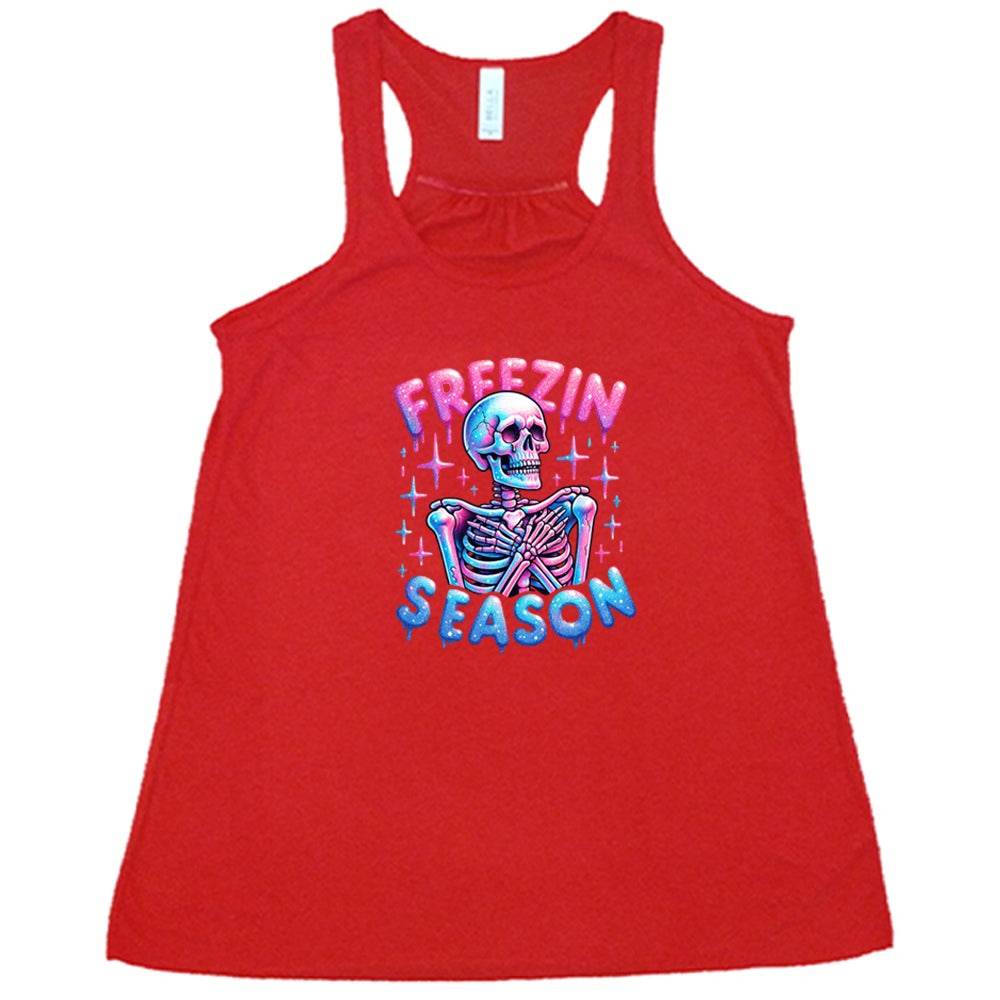 red shirt with the text "freezin season" with a graphic of a skeleton on it