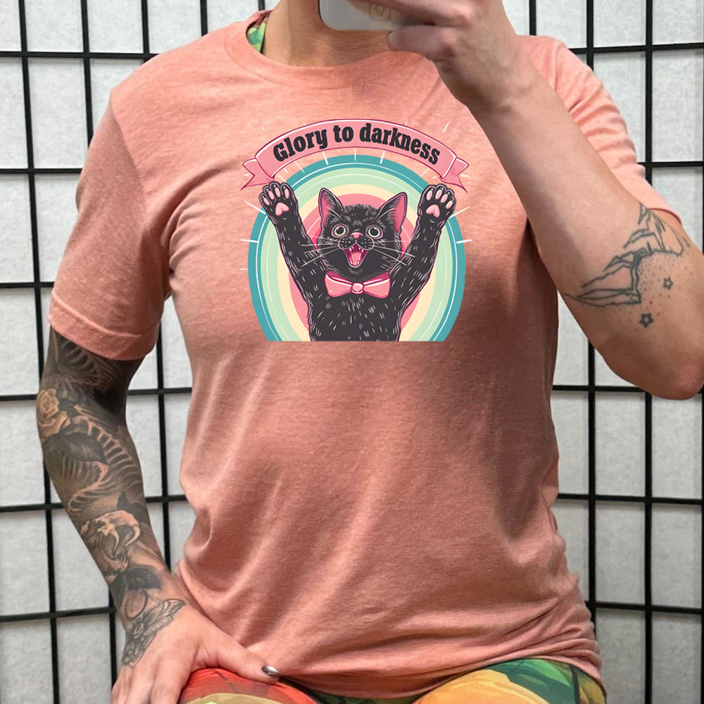 peach shirt with the saying "Glory To Darkness" on it 