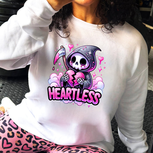 white crewneck with the text "Heartless" on it