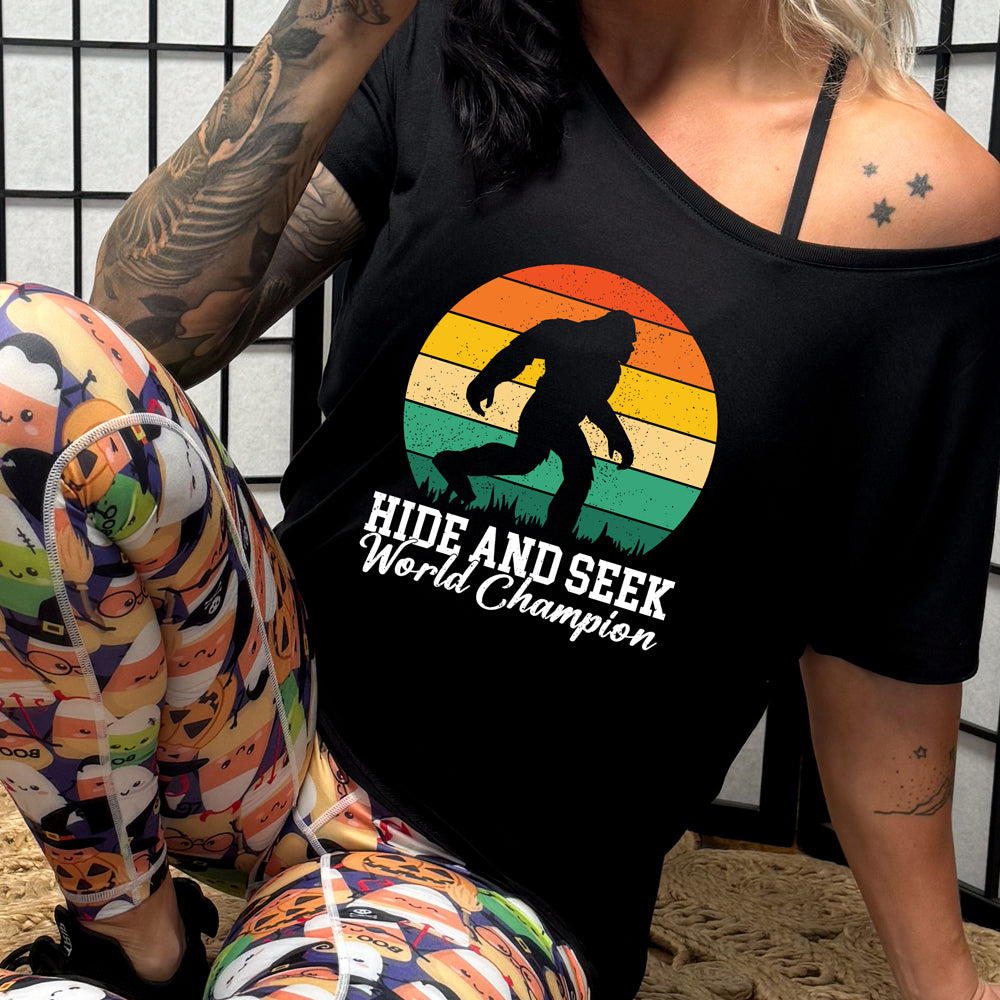 black slouchy shirt with the text "Hide And Seek World Champion" on it