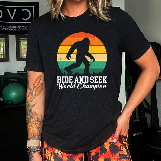 black shirt with the text "Hide And Seek World Champion" on it