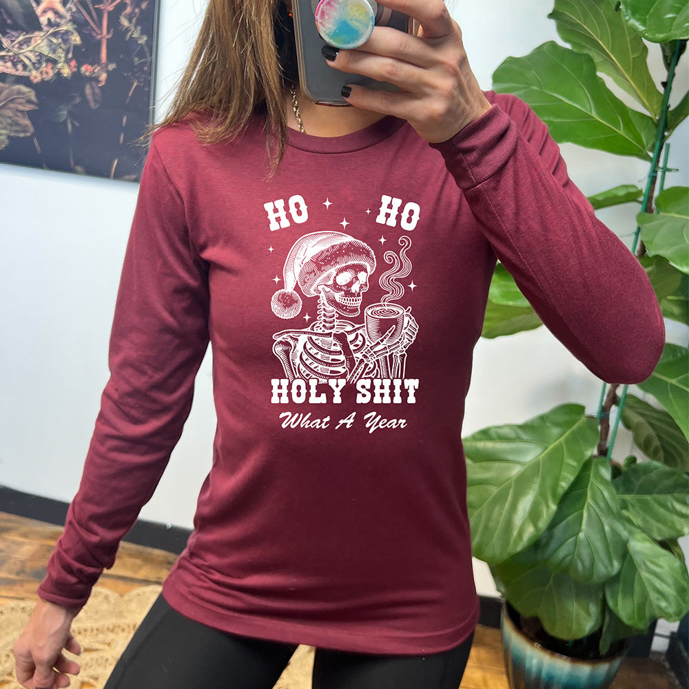 maroon long sleeve shirt with the text "Ho Ho Holy Shit What A Year" on it