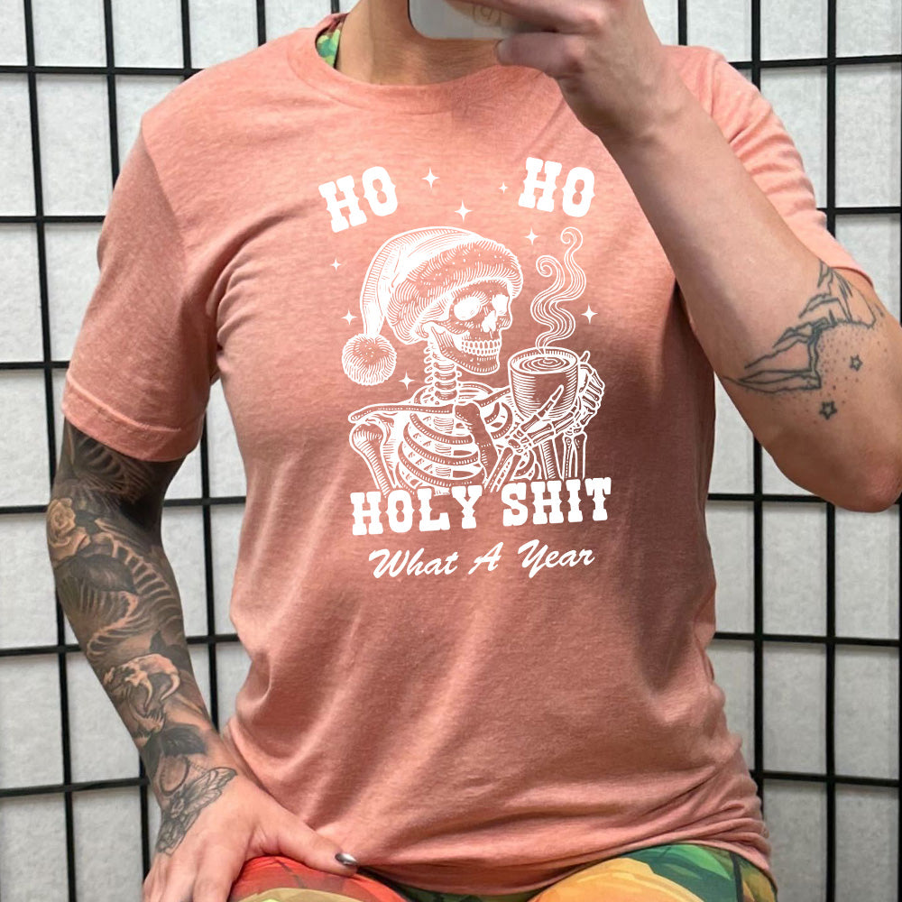 peach shirt with the text "Ho Ho Holy Shit What A Year" on it