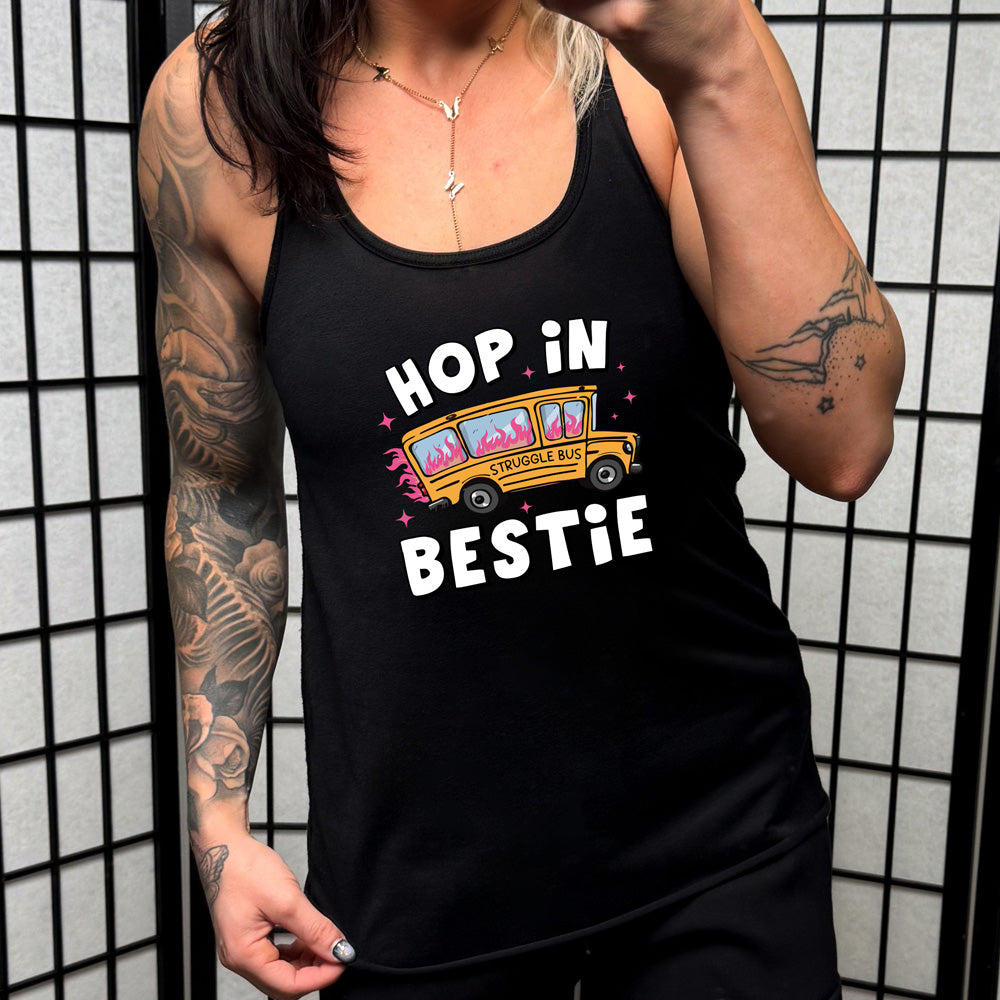 black shirt with the text "Hop In Bestie" on it