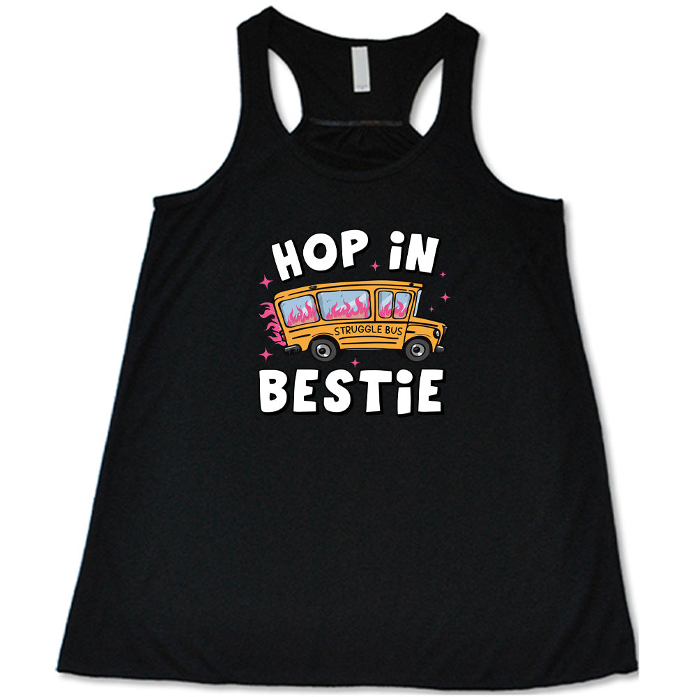 black shirt with the text "Hop In Bestie" on it