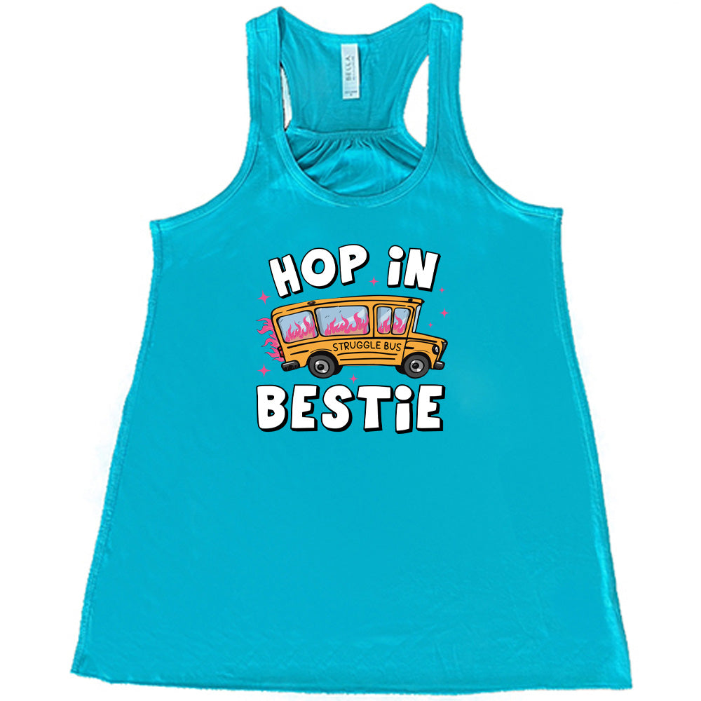 teal shirt with the text "Hop In Bestie" on it