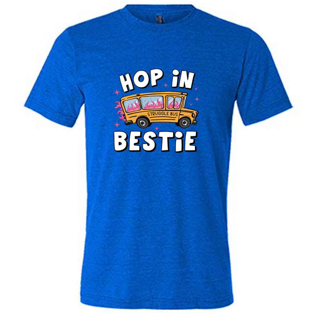 blue shirt with the text "Hop In Bestie" on it