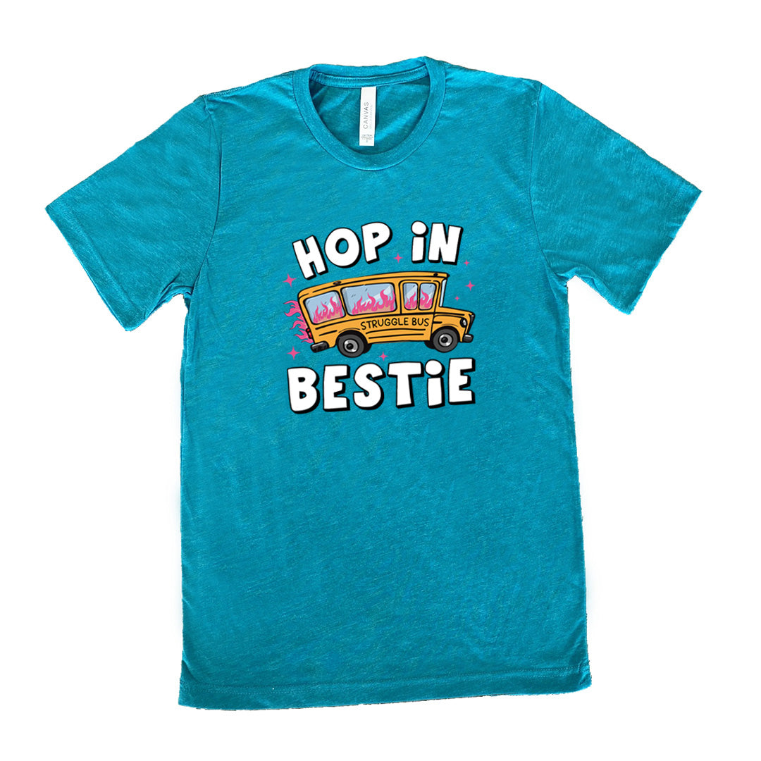 teal shirt with the text "Hop In Bestie" on it