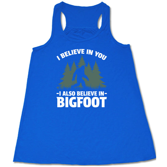 blue shirt with the text "I Believe In You I Also Believe In Bigfoot" on it