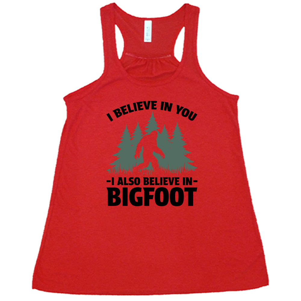 red shirt with the text "I Believe In You I Also Believe In Bigfoot" on it