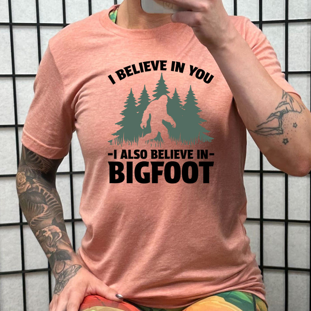 peach shirt with the text "I Believe In You I Also Believe In Bigfoot" on it