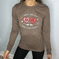 brown long sleeve shirt with the text "I Hate You Less Than Other People" on it