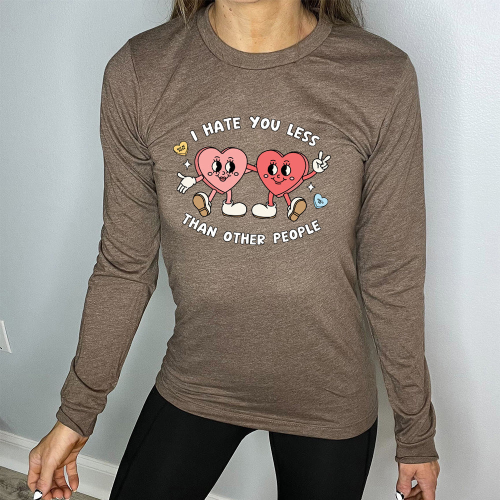 brown long sleeve shirt with the text "I Hate You Less Than Other People" on it