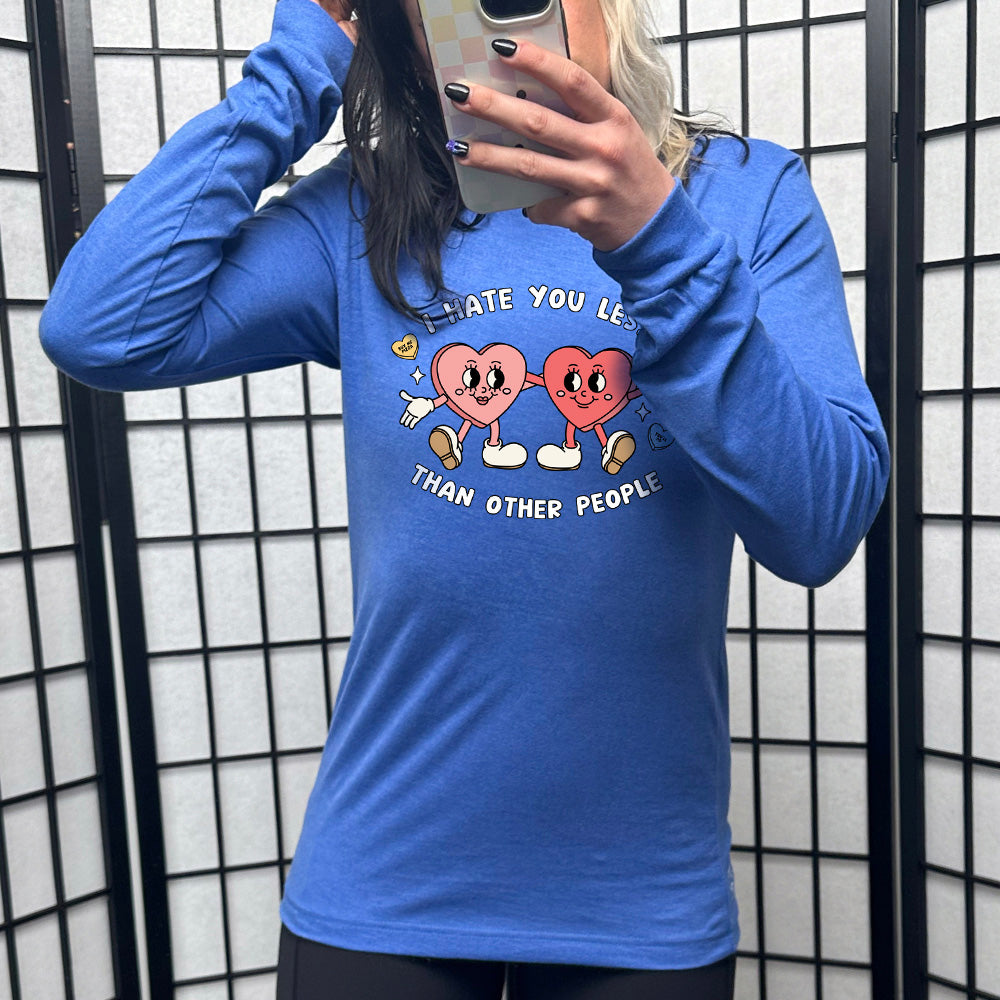 blue long sleeve shirt with the text "I Hate You Less Than Other People" on it