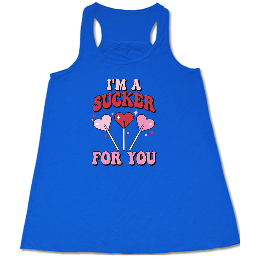 blue shirt with the text "I'm A Sucker For You" on it