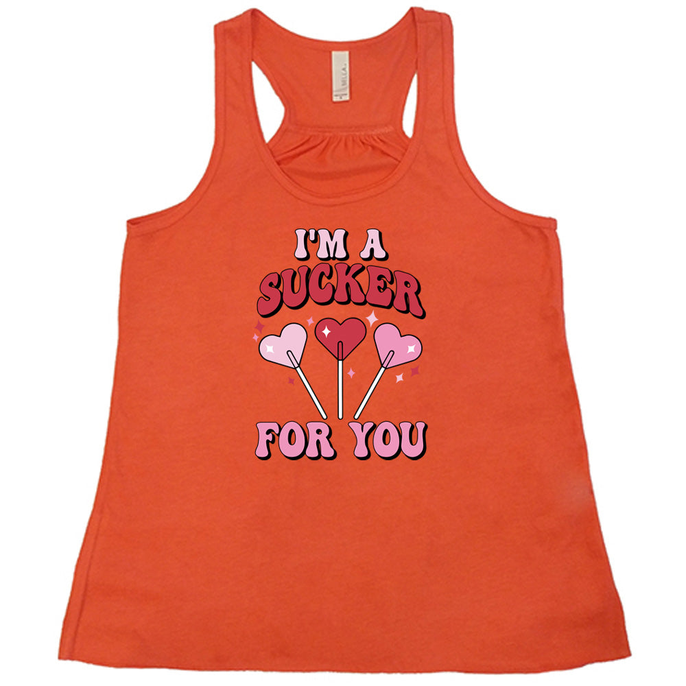 coral shirt with the text "I'm A Sucker For You" on it