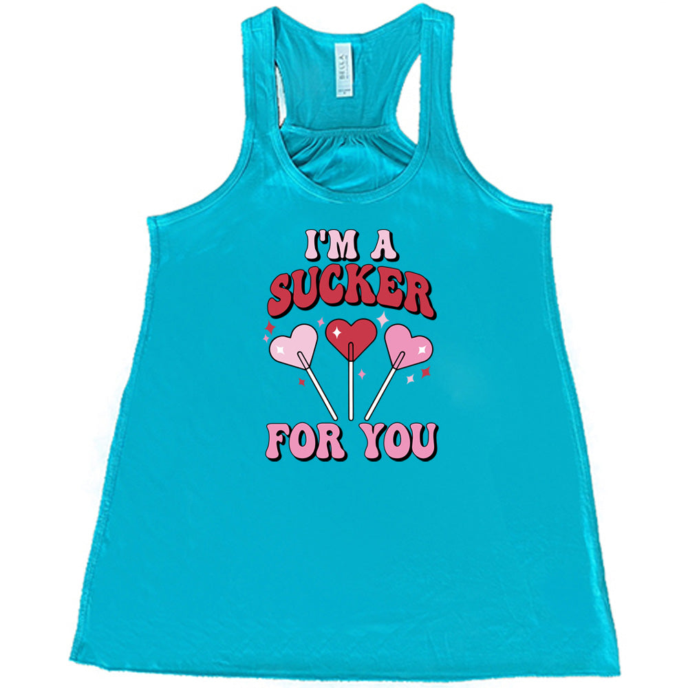 teal shirt with the text "I'm A Sucker For You" on it