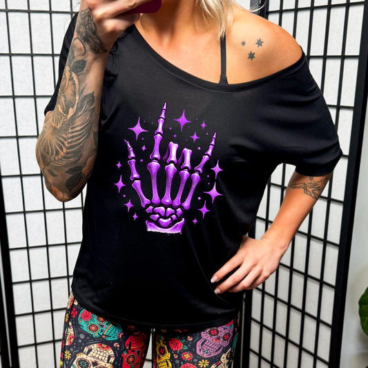 black slouchy shirt with a Purple Skeleton Hand graphic on it