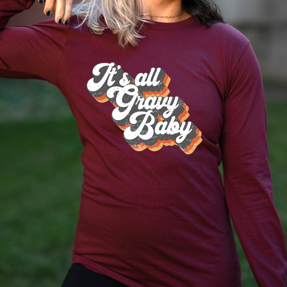 maroon long sleeve shirt with the text "It's All Gravy Baby" on it