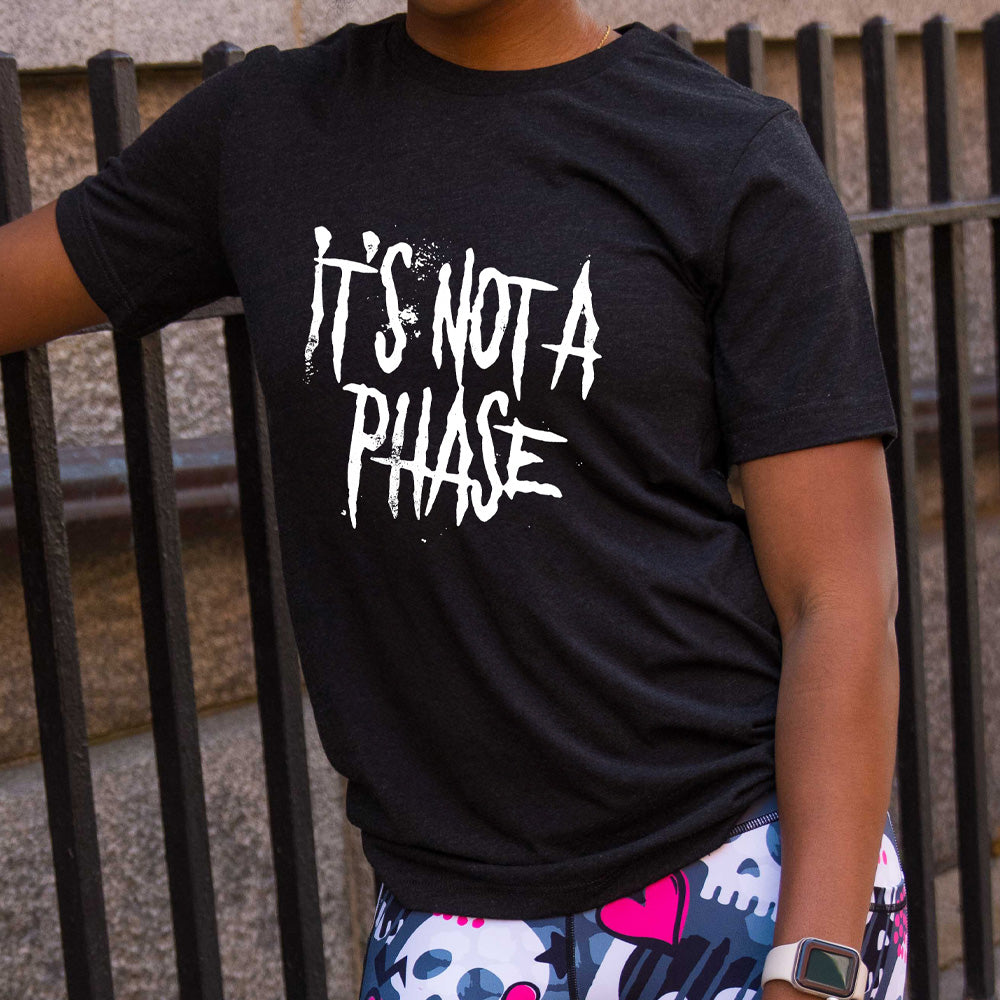 black shirt with the text "It's Not A Phase" on it