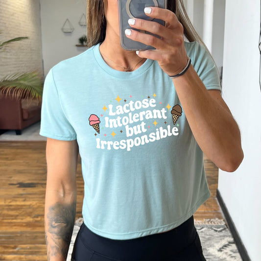 dusty blue cropped tee with the text "Lactose Intolerant But Irresponsible" on it