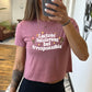 mauve cropped tee with the text "Lactose Intolerant But Irresponsible" on it