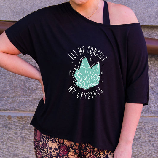 black slouchy shirt with the text "Let Me Consult My Crystals" on it