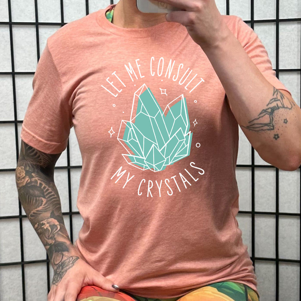 coral shirt with the text "Let Me Consult My Crystals" on it